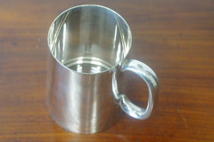 A superb antique sterling silver pint mug or tankard with a glass bottom hallmarked on the base