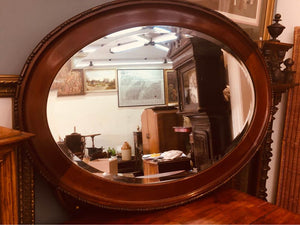 Edwardian mahogany oval mirror with double beveled edge in beautiful condition