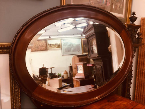 Edwardian mahogany oval mirror with double beveled edge in beautiful condition